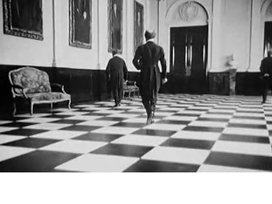 O DINHEIRO, mise=en=scene jogo de xadrez